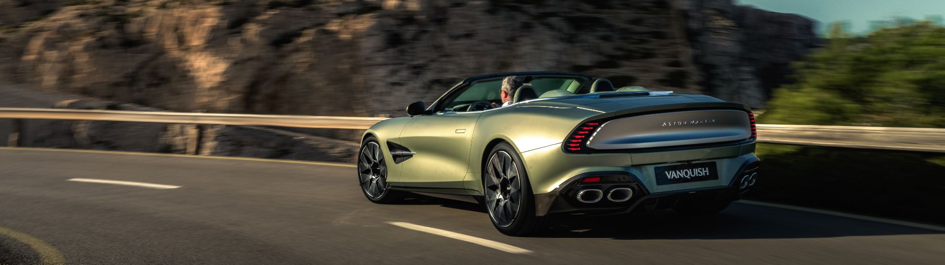 Aston Martin Vanquish Volante 2025 model review view image of car driving along the road